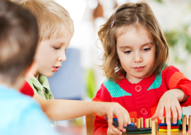 little girl playing with toys