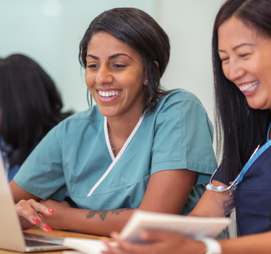 smiling nurses wearing scrubs