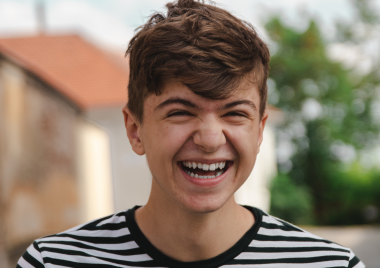 Teenage boy smiling and laughing