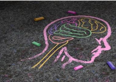 Drawing of a head and a brain in chalk