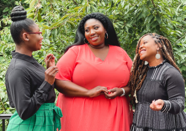 group of three black women talking to each other